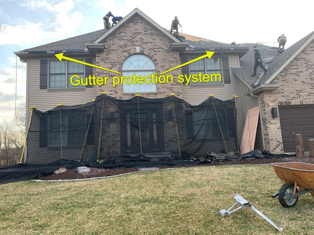 Pro-Choice-roofing-crew-using-our-gutter-protection-system